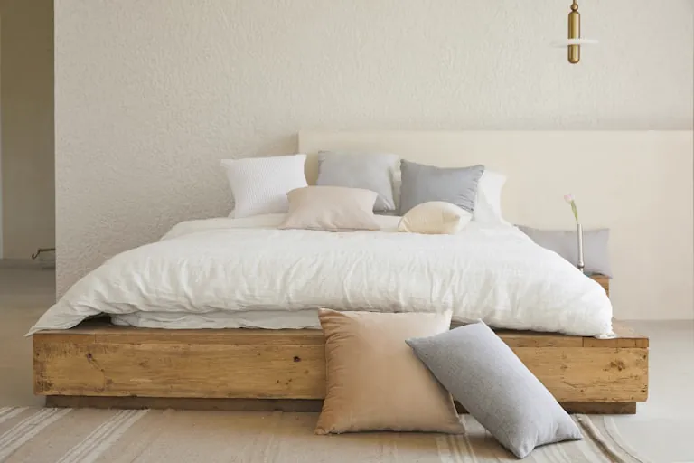 10 Bedroom Wall Decor Ideas That Transform Any Space (With Budget Options) 1 bedroom wall decor ideas - styled bedroom with curated wall art and lighting