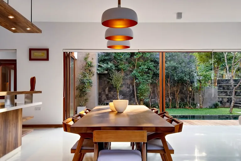 Dining Room Decor Ideas for 2026: Design a Space Worth Lingering In 1 dining room decor ideas - styled dining table with statement chandelier